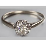 AN 18CT WHITE GOLD AND DIAMOND SOLITAIRE, rose-cut diamond claw set in floral form, ending on a