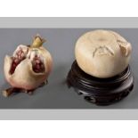 TWO JAPANESE IVORY CARVINGS, MEIJI PERIOD, CIRCA 1900, one of a tangerine, the other of a