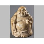 A CHINESE IVORY CARVING OF HOTEI, 20TH CENTURY, Hotei holding a bag and a fruit with a happy smile