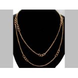 A 9CT YELLOW GOLD CHAIN, box links interspaced with eight curb links, ending in a circular clasp,