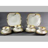 AN ART DECO SHELLEY PORCELAIN TEA SET, comprising ten cups and saucers and two square cake