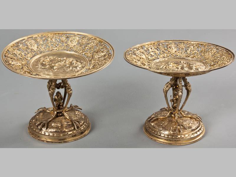 A PAIR OF GERMAN SILVER GILT PEDESTAL COMPORTS, HANAU MARKS, with beaded rims, the borders profusely