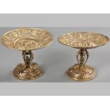 A PAIR OF GERMAN SILVER GILT PEDESTAL COMPORTS, HANAU MARKS, with beaded rims, the borders profusely