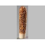 A LARGE DEEPLY CARVED IVORY STAFF HANDLE, FIRST HALF OF THE 20TH CENTURY, decorated with warrior