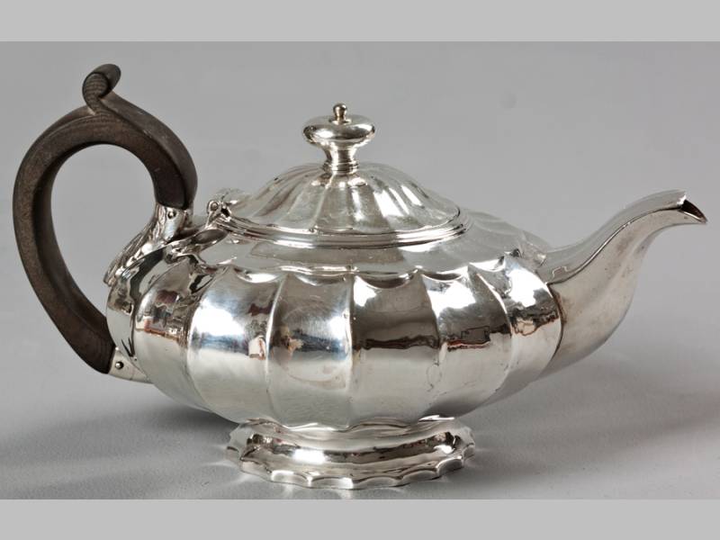 A GEORGE IV SILVER TEAPOT LONDON 1822, R.O., hinged top with removable finial, C-scroll fruitwood