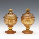 Near Pair of Bohemian Amber Glass Footed BonbonniÃ¨res with Covers, ca. 19th Century