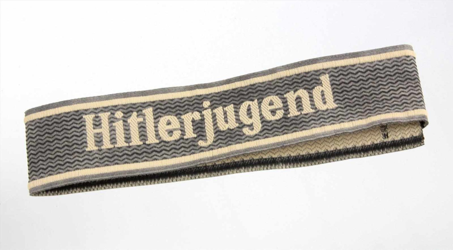 Ärmelband graues Band mit Schriftzug *Hitlerjugend* auf Zackengrun, seitlich *BEVO-Wuppertal*, B ca.