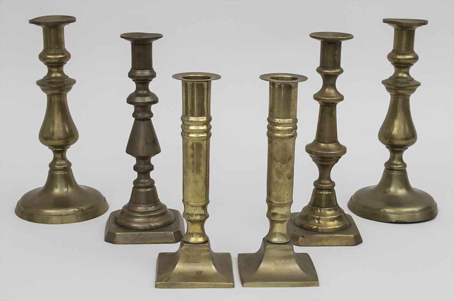 3 Paar Kerzenleuchter / 3 pairs of candlesticks, 20. Jh. Material: Messing, Höhen: 20 - 23 cm,
