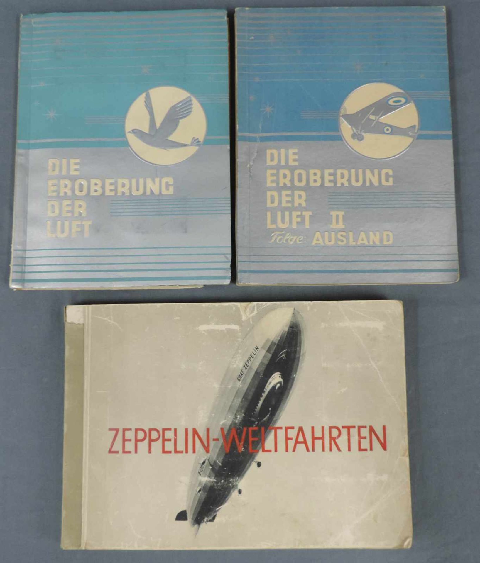 Zwei Zigarettenbilderalben 'Die Eroberung der Luft 1 + 2' und 1 Album Zeppelin. Zwei