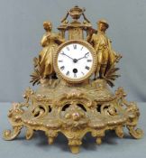 Kaminuhr. Wohl 19. Jahrhundert. 33 cm x 31 cm. Metallfiguren mit integrierter Uhr zum aufziehen.