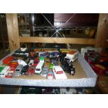 A quantity of toy cars [pine shelves top of stairs]