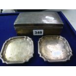A pair of silver ashtrays, 3 oz, and a silver overlaid cigarette box
