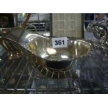 A reproduction silver sauceboat with flying scroll handle, Birmingham 1965, 7.2 oz