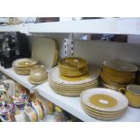 A Denby yellow ground dinner and tea service including plates, bowls and serving dish etc. and a