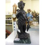 A bronze figure of a putto hunter holding game, on stone base [V]