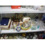 A quantity of glassware to include vases, paperweights and decanters, a ceramic egg crook, an