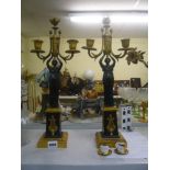 A good pair of Empire three-light candelabra in bronze and ormolu, each with a female figure