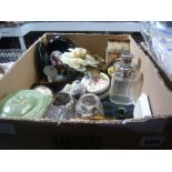 A carton of miscellaneous items including silver mounted bottles, hardstone floral candle holder,