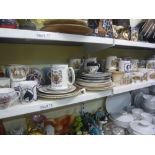 Two shelves of commemorative china comprising mugs, beakers, glasses and plates [s75 & 78]