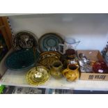 A good collection of slipware including large bowls, platters and jugs, an early brass jam spoon,