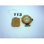 A 9 ct gold lady's wristwatch and a 9ct gold locket