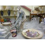 A large Lladro figure of Hamlet, two plates decorated with roses and a Royal Doulton character