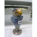 A Martinware stoneware Wally bird tobacco jar, as a standing bird of prey with supercilious