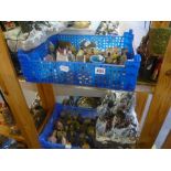 A large collection of model cottages, Christmas displays and boxed children's games [pine shelves