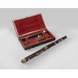 CLARINET IN ROSEWOOD, END 19TH CENTURY in three elements with finishes in silvered metal. French