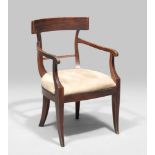 A SMALL BEECH ARMCHAIR, EARLY 19TH CENTURY back to folder with perforated curved armrests and shaped