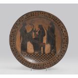 ETRUSCAN STYLE DISH, EARLY 20TH CENTURY in clay and black varnish and redhead. Ample cavetto