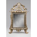 MIRROR IN GILDED WOOD, GENOESE STYLE, ANCIENT ELEMENTS with superior frieze to eardrum with