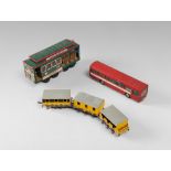 THREE MODELLINIS, 20TH CENTURY in metal and plastics, representing streetcars, bus and wagons.