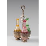THREE LIQUEUR BOTTLES, BEGINNINGS 20TH CENTURY in crystal cut to colored fund. Complete of
