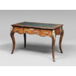 ROSEWOOD DESK, EARLY 20TH CENTURY Louis XV style, with floor to scroll with green skin. Faced with