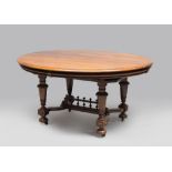GREAT WALNUT TABLE, 19TH CENTURY with extensible oval plan and base to four conic legs with