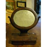 A STAINED WALNUT TOILET, 19TH CENTURY with mirror oval and a drawer in the lower part. Measures