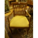 WALNUT ARMCHAIR, 19TH CENTURY with back pierced to basket and shaped arms. Measures cm. 89 x 58 x