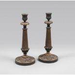 A PAIR OF METAL AND BRONZE CANDLESTICKS, EMPIRE PERIOD to gilded patina and burnished, with stem.