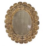 MIRROR IN GILDED WOOD, END 18TH CENTURY to oval order, graven to garland of laurel and shells in