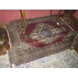 HAMADAN CARPET, EARLY 20TH CENTURY to double medallion with claws, in the central field to red fund,