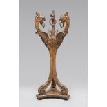 WALNUT SHELVES, EARLY 19TH CENTURY with pillars carved with figures of griffins, with rings at the