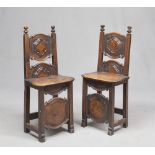 A PAIR OF WALNUT BANCHES, 19TH CENTURY of seventeenth-century taste. Backs with ashlar, plain legs