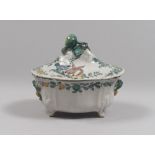A SMALL MAIOLICA TUREEN, CERRETO LATE 18TH CENTURY to white enamel, green and ochre, with decorum to