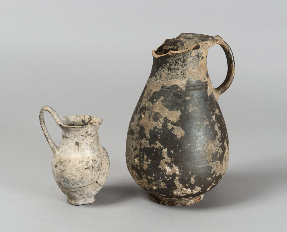 A OLPE AND A BLACK GLAZED JUG, 4TH-3TH CENTURY B.C.