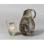 A OLPE AND A BLACK GLAZED JUG, 4TH-3TH CENTURY B.C.