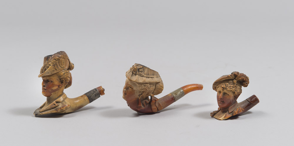 THREE PIPE, EARLY 20TH CENTURY with figurative bath upside of bridesmaids in various capigliature.