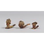 THREE PIPE, EARLY 20TH CENTURY with figurative bath upside of bridesmaids in various capigliature.