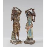 A PAIR OF PLASTER SCULPTURES, FIRST HALF 20TH CENTURY in polychrome, representing bearer and carrier