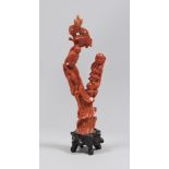 A CHINESE CORAL GROUP, EARLY 20TH CENTURY depicting He Xiangu. Measures cm. 16 x 6 x 2. GRUPPO IN